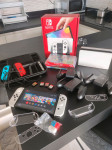 Nintendo Switch OLED s 4 igrami in dodatki