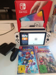 Nintendo Switch OLED + igre + garancija