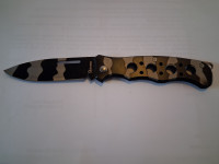 Novi ,žepni nož,ima nastavek za pripenjanje.