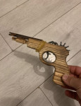Lesena igrača - 2x pištola na elastike