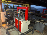 Linija avtomatskega ovijanja desk "buntkov" v pp trak