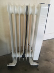 Sedem-rebrni oljni radiator s termostatom in 1500 W grelcem Tristar