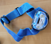 Naglavna svetilka ENERGIZER, nova, zelo dobro sveti, modre barve