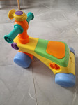 Plastičen poganjalec Tomy