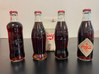 CocaCola - Zbirateljski set štirih zgodovinskih stekleničk CocaCole