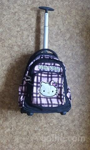 Torbica z drogom in kolesi-nahrbtik Hello Kitty