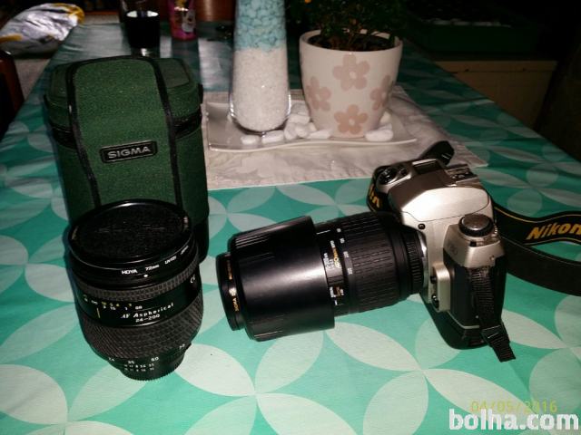 Analogen fotoaparat Nikon F80 z objektivoma tokina in sigma