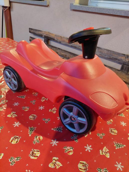 Otroški poganjalček na volan rdeče barve zelo lepo ohranjen ODLIČEN