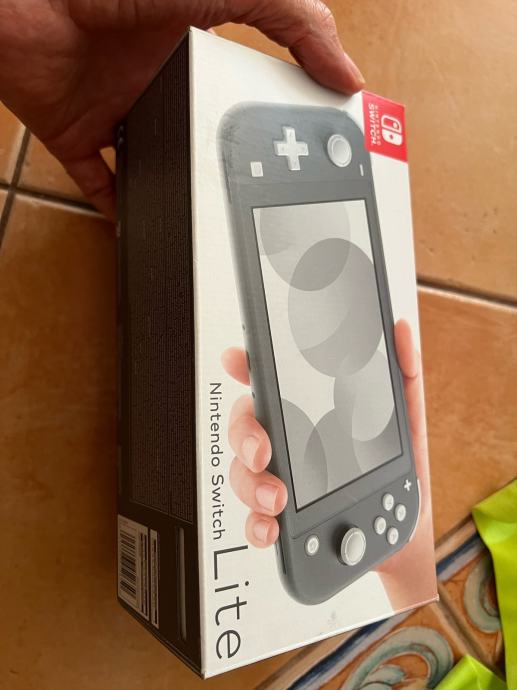 Nintendo Switch lite + Zelda botw + case