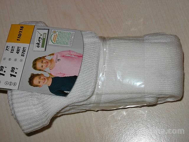 Nove otroške hlačne nogavice št.110/116 - bele