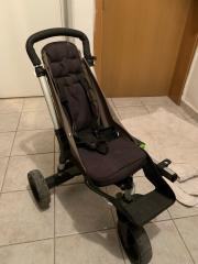 Manjši voziček, ki se priključi na osnovni voziček za prevoz 2. otroka